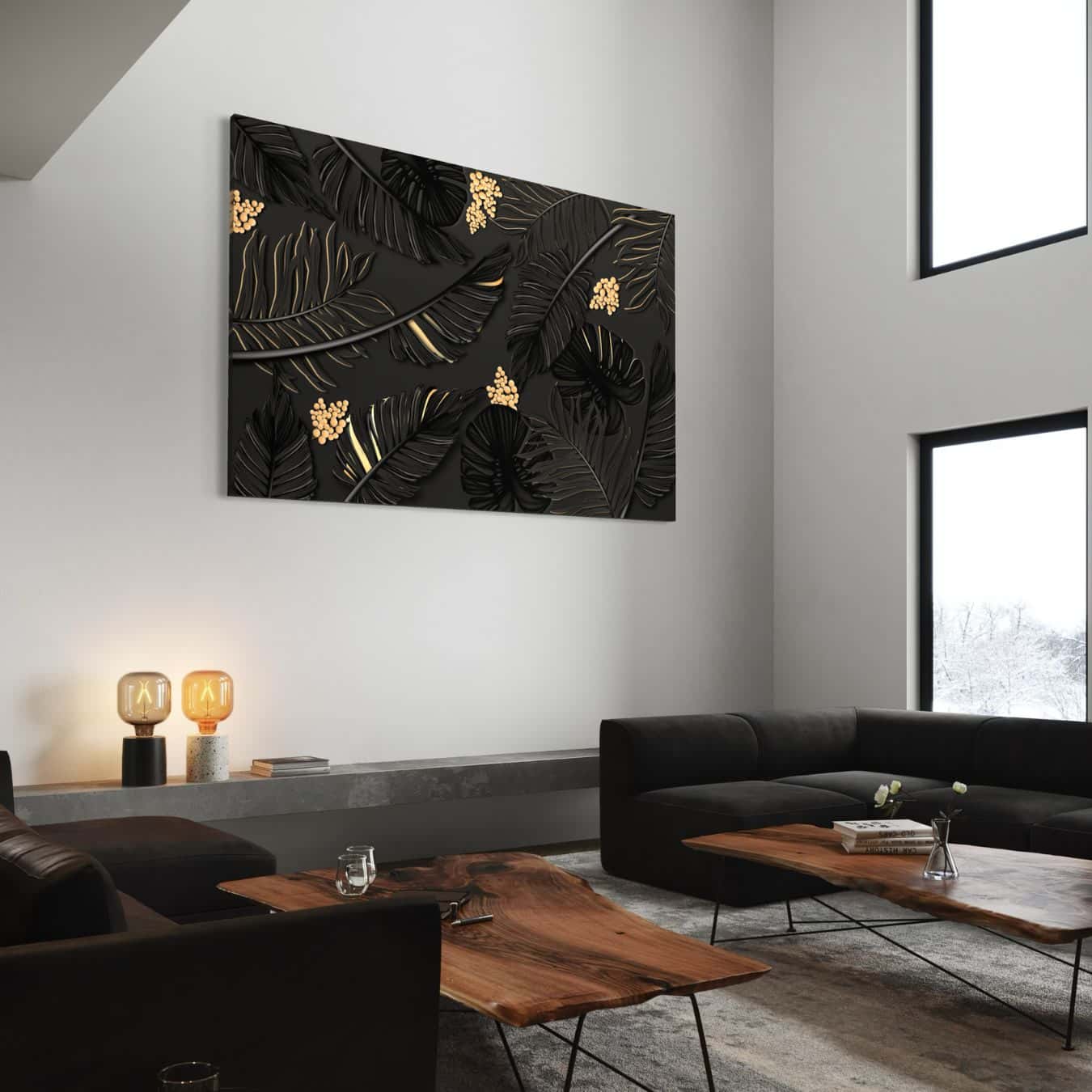 Canvas wanddecoratie met zwart bladmotief en goudkleurige accenten aan muur.